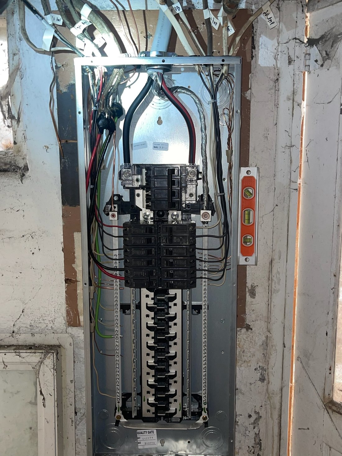 A newly installed residential load center with conductors dressed and every circuit labeled